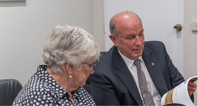 funeral director helping a woman
