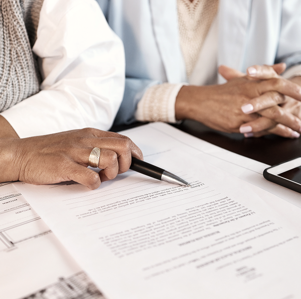 two people doing paperwork