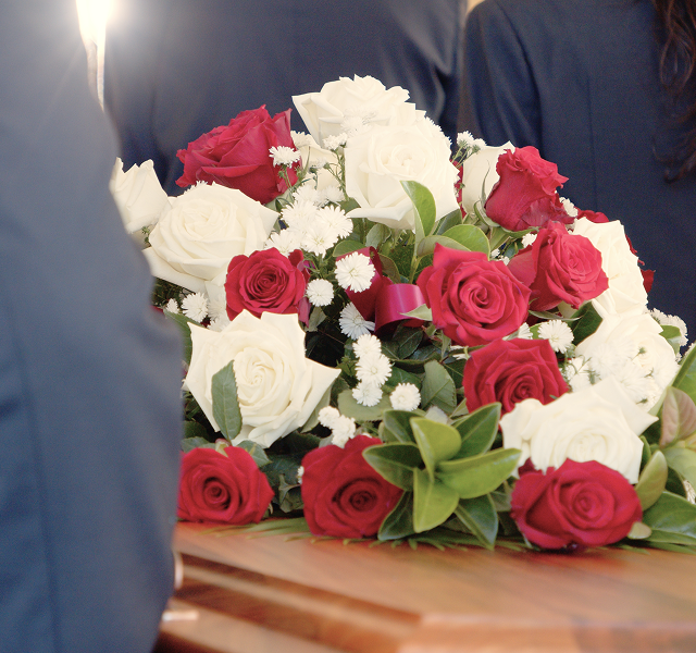 flowers on top of coffin