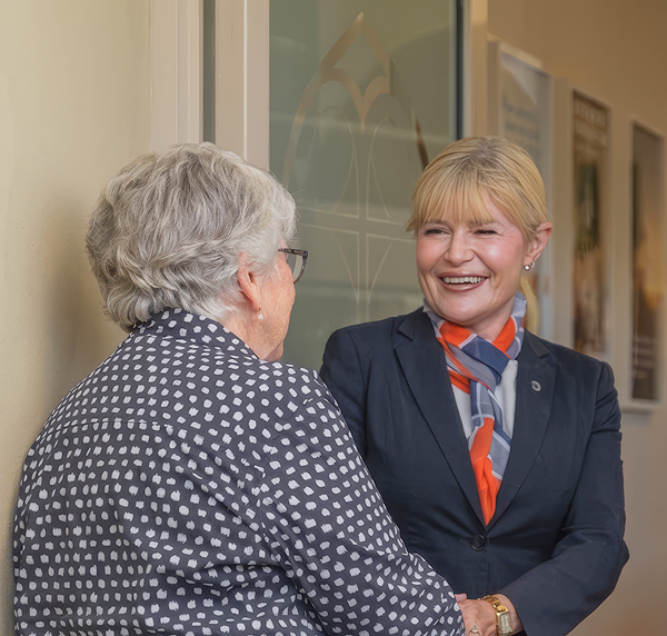 Narooma District funeral director talking with a woman