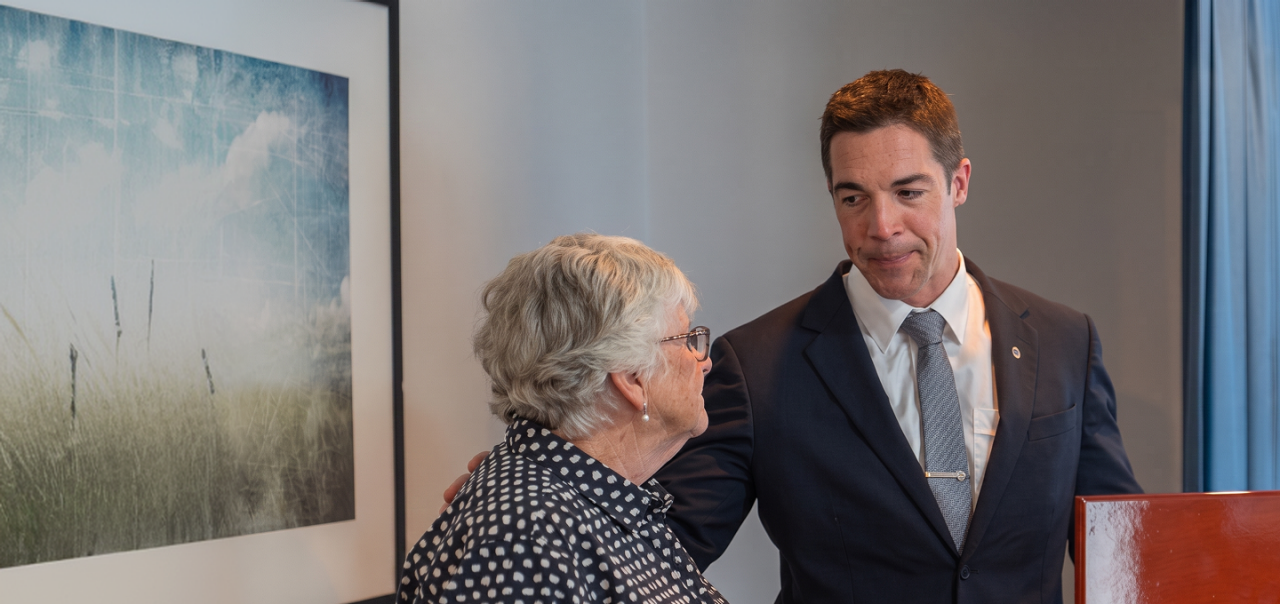 Narooma District funeral director helping a woman